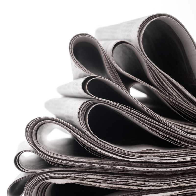 newspapers-folded-stacked